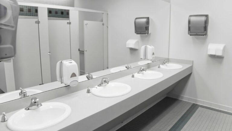 Commercial bathroom with bad odors and clogged vents requiring Houston commercial plumbing repair